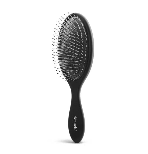 Three-quarter view of black Wet/Dry round paddle brush by Kitsch