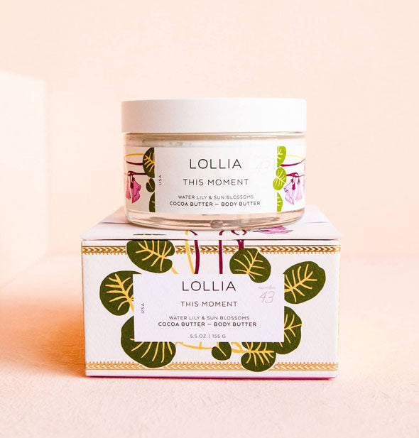 Jar and box of Lollia This Moment Body Butter feature stylized florals and leaves accented by gold