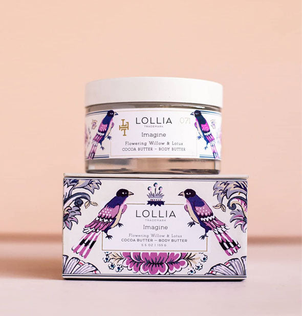 Jar and box of Lollia Imagine Body Butter with blue and purple birds and floral patterning