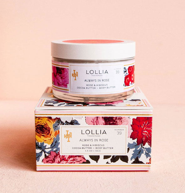 Jar and box of Lollia Always In Rose Body Butter, both with colorful floral patterning