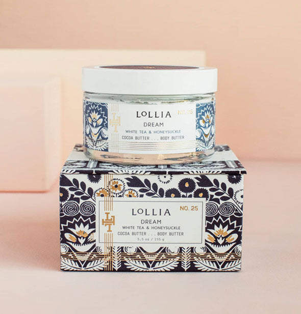 Jar and box of Lollia Dream Body Butter with blue and gold floral patterning