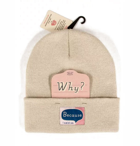 Tan knit beanie has a card tucked into its fold that says, "Why" and a sewn-on label that responds, "Because I said so."
