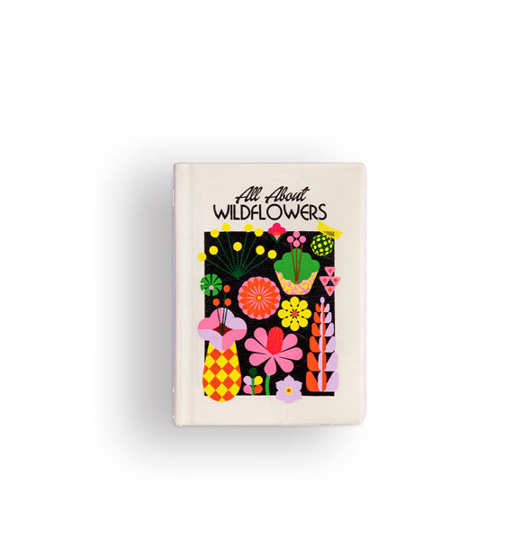 White foam toy designed to resemble a rectangular textbook titled, "All About Wildflowers" with colorful floral illustrations on a black background