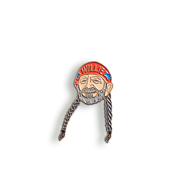 Willie Nelson enamel pin depicts the artist smiling with two long braids and wearing a red hat that says "Willie" between two blue stars
