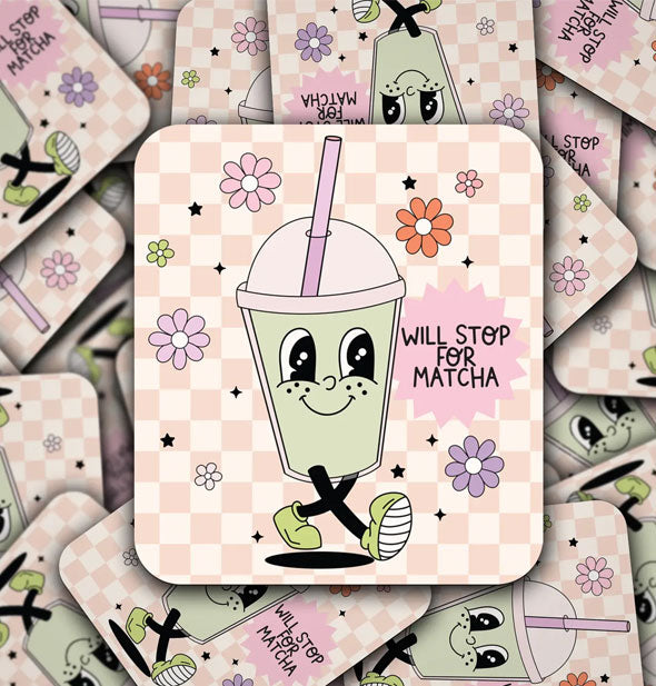 Pile of square stickers featuring illustration of a smiling domed cup with legs on a pink checkered background scattered with pastel flowers and the words, "Will stop for matcha" in small black lettering
