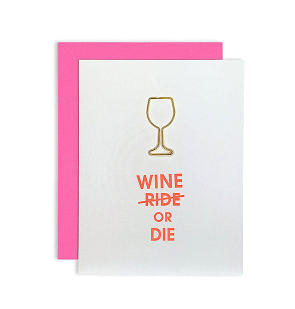 White greeting card with pink envelope behind says, "Wine (ride) or die" in orange lettering with a gold wine glass outline above