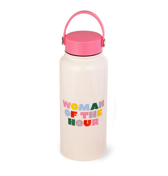 White water bottle with pink handled lid says, "Woman of the hour" in multicolored lettering