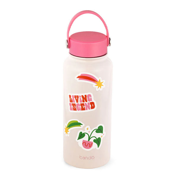 White and pink water bottle decorated with comet, potted plant, and shooting star stickers