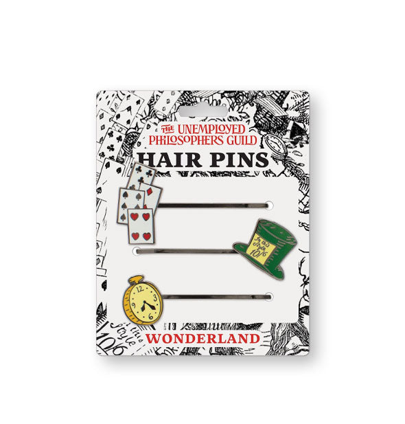 Black and white illustrated card affixed with Wonderland-themed hair pins featuring enamel accents of playing cards, hatter's hat, and pocket watch by The Unemployed Philosophers Guild