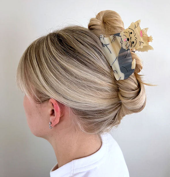 Model wears a Yorkie claw clip in a French twist hairstyle
