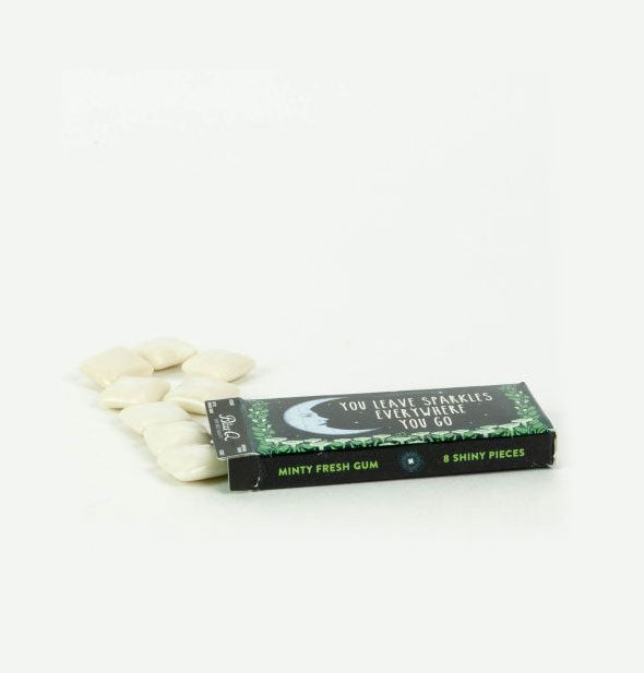 Crescent moon and flowers gum pack lays on its side spilling out contents