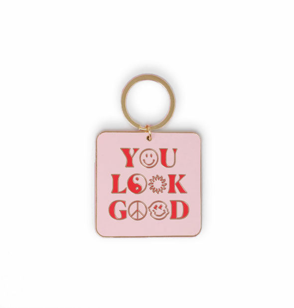 Light pink square keychain with rounded corners on gold ring says, "You look good" with smiley faces, sun, peace sign, and yin yang symbol in place of the Os