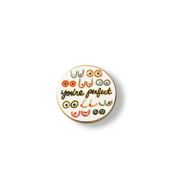 Round white enamel pin features illustrations of breasts and the words, "You're perfect" in black script in the center
