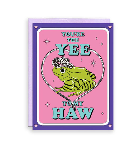 Pink and purple greeting card backed by a purple envelope features illustration of a green frog wearing an animal print cowboy hat inside a rope heart and the message,  "You're the Yee to my Haw" in blue lettering