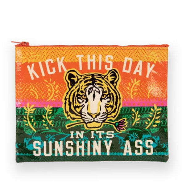 Half orange-pink, half green rectangular pouch features botanical accents around a central tiger face illustration and the words, "Kick this day in its sunshiny ass"