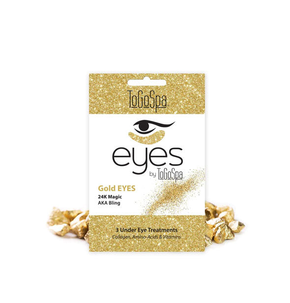 Pack of Gold EYES Under Eye Treatments by ToGoSpa staged with pieces of gold material