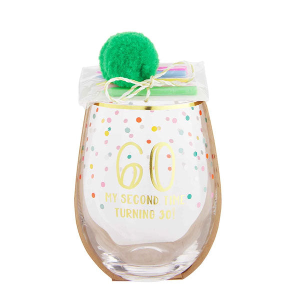 Stemless wine glass with gold rim, colorful confetti design, and green pom pom with birthday candle pack attached says, "60, My Second Time Turning 30!" in gold foil lettering