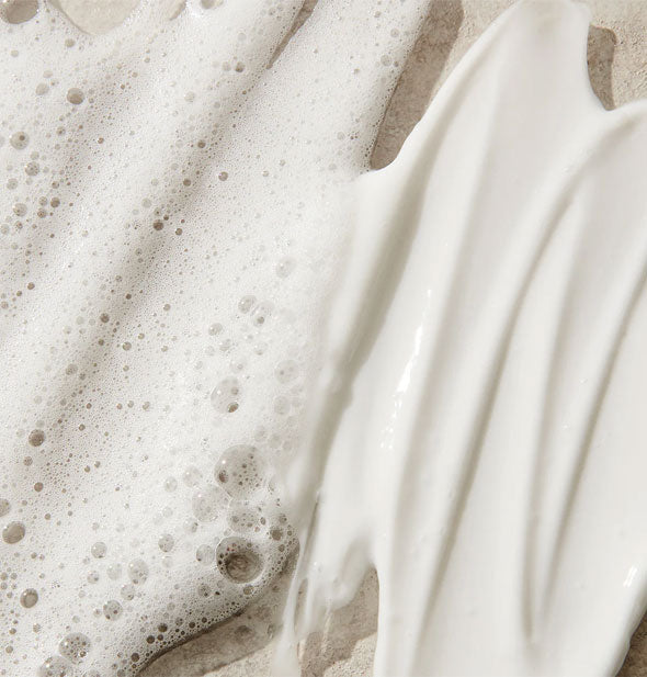 Closeup of white sudsy and creamy hair products