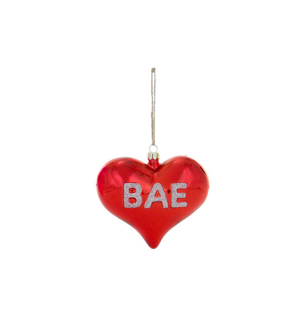 Red heart-shaped ornament on string says, "Bae" in glittery silver lettering