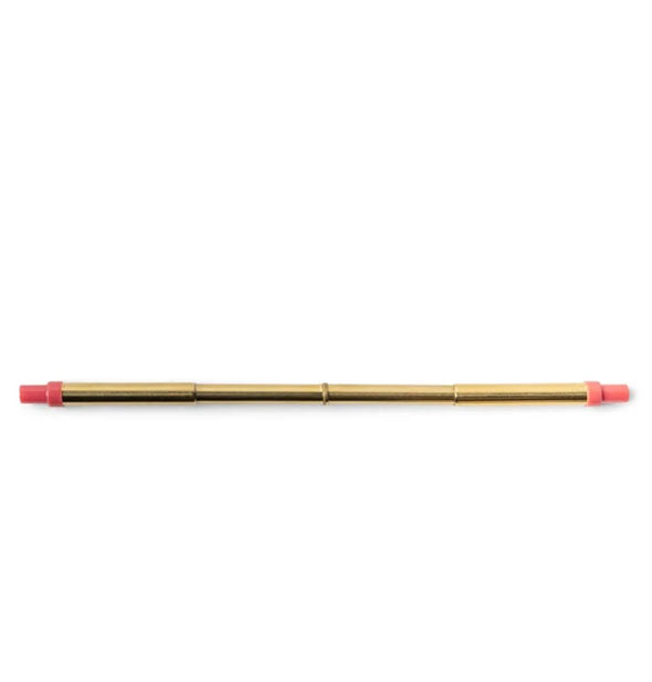 Extended gold-toned stainless steel straw with magenta plastic tips