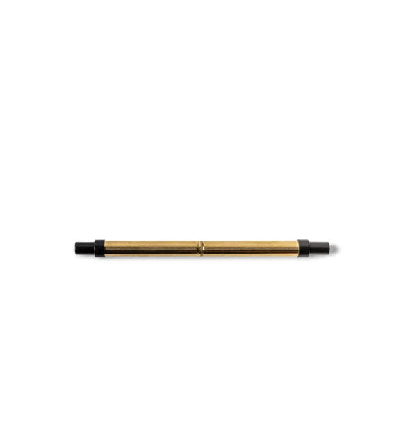Collapsed gold-toned stainless steel straw with black plastic tips