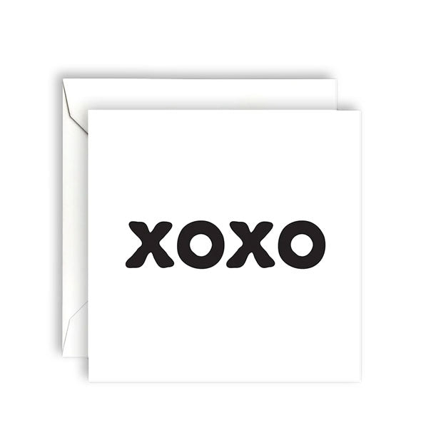 Square white greeting card with envelope says, "XOXO" in black lettering