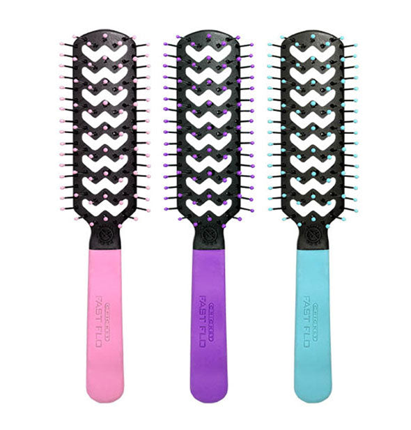 Three hairbrushes with pink, purple, and light blue handles and bristle ball tips respectively