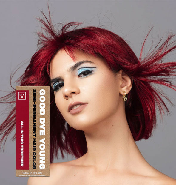 Model with bright maroon hair color by Good Dye Young in the shade All In This Together