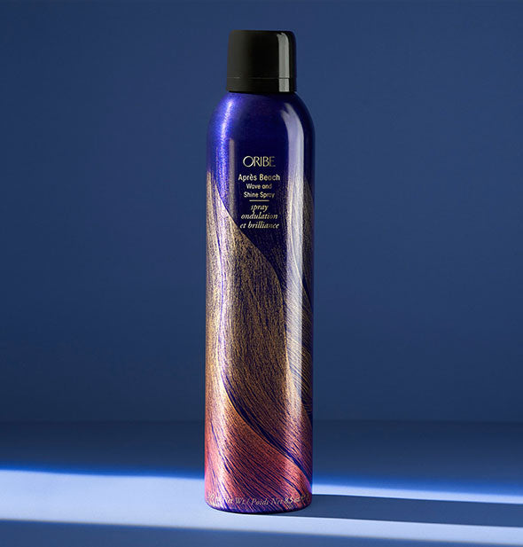 8.5 ounce can of Oribe Après Beach Wave and Shine Spray on a blue background