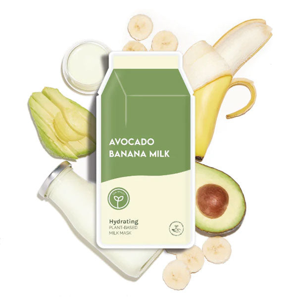 Carton-shaped Avocado Banana Milk sheet mask packed rests on top of pieces of avocado and banana and a glass milk bottle, 