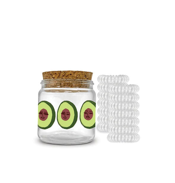 Cork-lidded jar with avocado face illustrations is paired with 12 clear spiral hair ties