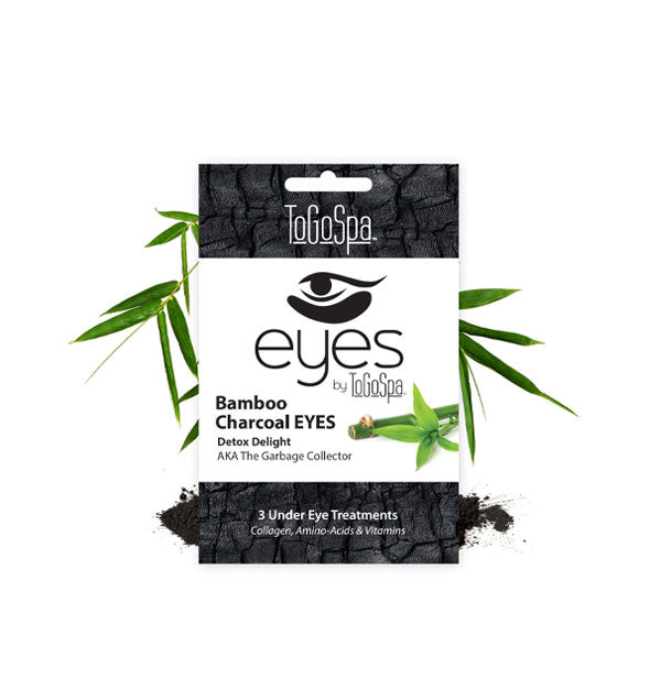 Pack of Bamboo Charcoal EYES Detox Delight Under Eye Treatments by ToGoSpa staged with green bamboo leaves and crushed black charcoal