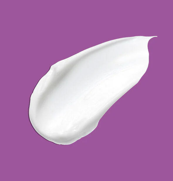 Sample of Bumble and bumble Curl Butter Mask on purple background shows product color and consistency