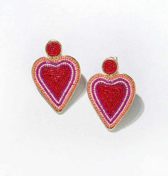 Pair of heart-shaped dangle drop earrings with red, pink, purple, and orange glass beads