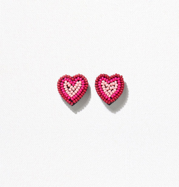 Pair of beaded tricolor heart-shaped earrings in pink shades