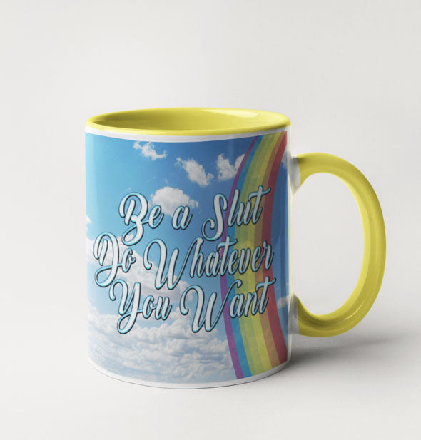 Coffee mug which features yellow inside and handle, external blue sky with clouds and rainbow design, and script that reads, "Be a slut, do whatever you want."