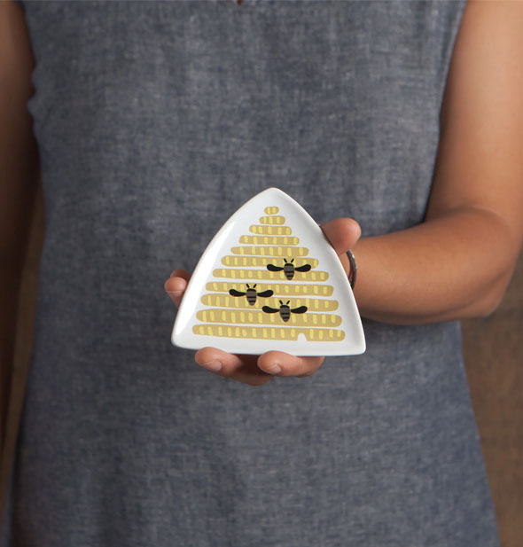 Model holds the Beehive Trinket Tray for size reference