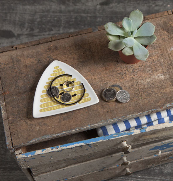 Beehive trinket dish on a rustic wooden dresser top with succulent, jewelry, and coins