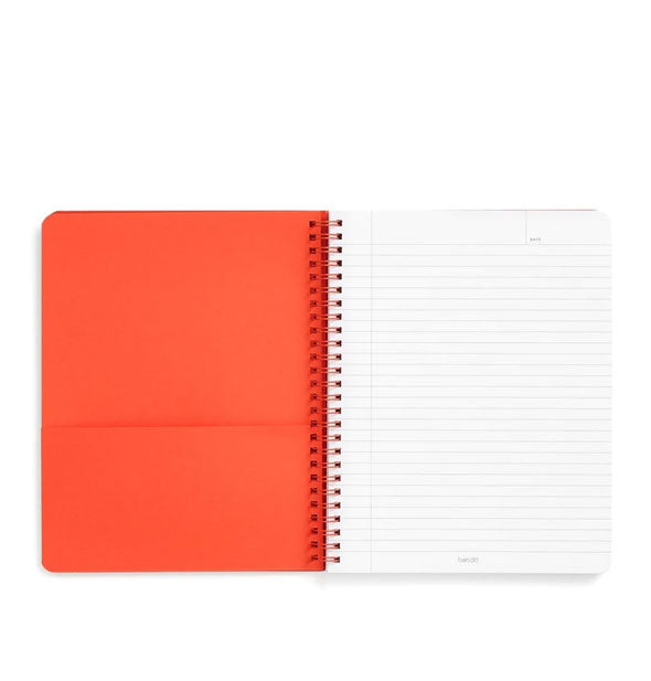 Open notebook with spiral-bound lined and orange pocket pages