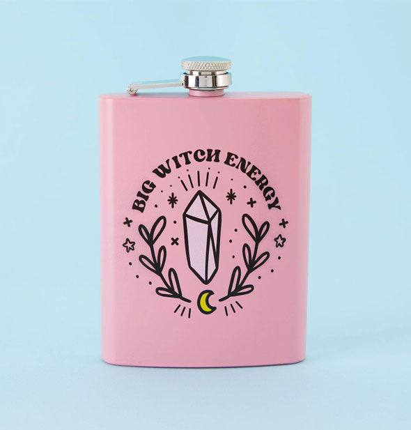 Rectangular pink flask with steel cap features illustrations of a crystal, branches, moon, and stars below the words, "Big Witch Energy"