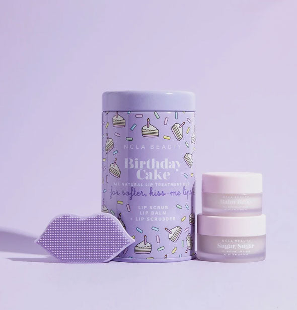 NCLA Beauty Birthday Cake Lip Care Duo tin with contents shown: two jars of product and one purple lip-shaped scrubber