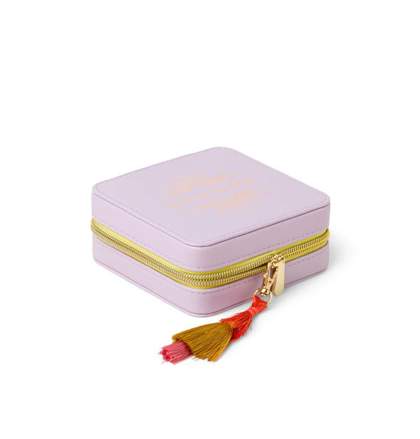 Angled view of purple jewelry case with gold zipper and colorful tassel zipper pull