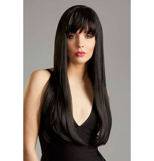Model wearing a long, black wig with bangs.