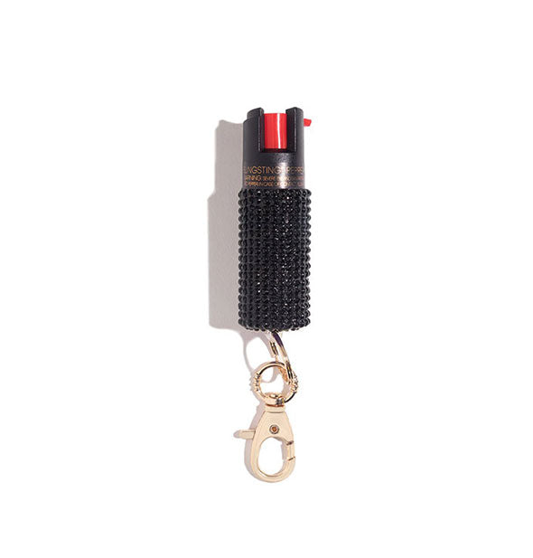 Black rhinestone-encrusted pepper spray canister with rose gold lobster clasp attached
