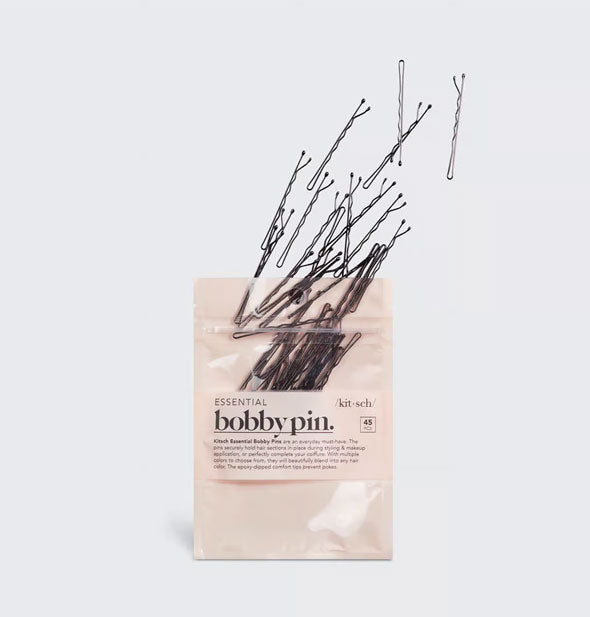 Pack of Essential Bobby Pins by Kitsch with the pins appearing to fly out of the packaging