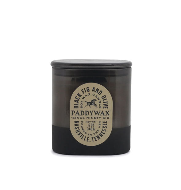 Black Fig and Olive Paddywax candle jar with black glass and beige type-heavy oblong label