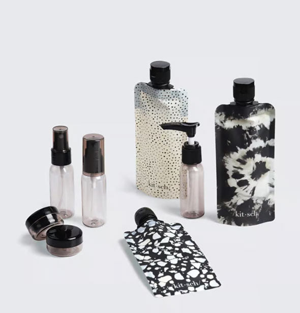Contents of the Black & Ivory Ultimate Travel Set by Kitsch includes three bottle pouches, two mini spray bottles, one mini pump bottle, and two jars