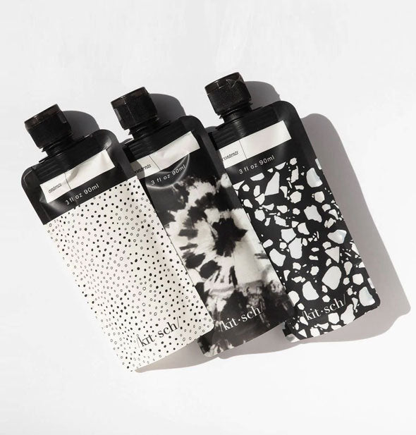 Three black and white Refillable Travel Pouches by Kitsch