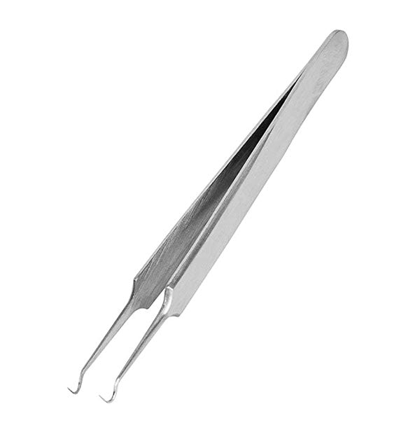Closeup of the stainless steel Lindo Black Out Blackhead Tweezer with hooked tips