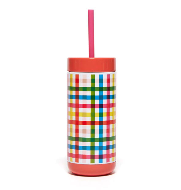 Cylindrical drink tumbler with red top, straw, and base, and colorful plaid print
